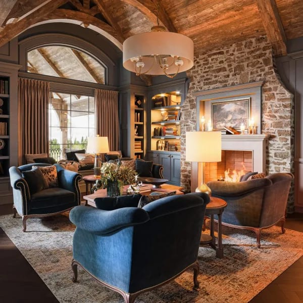 Architectural rendering of a chalet lounge with stone fireplace and timber vaulted ceiling