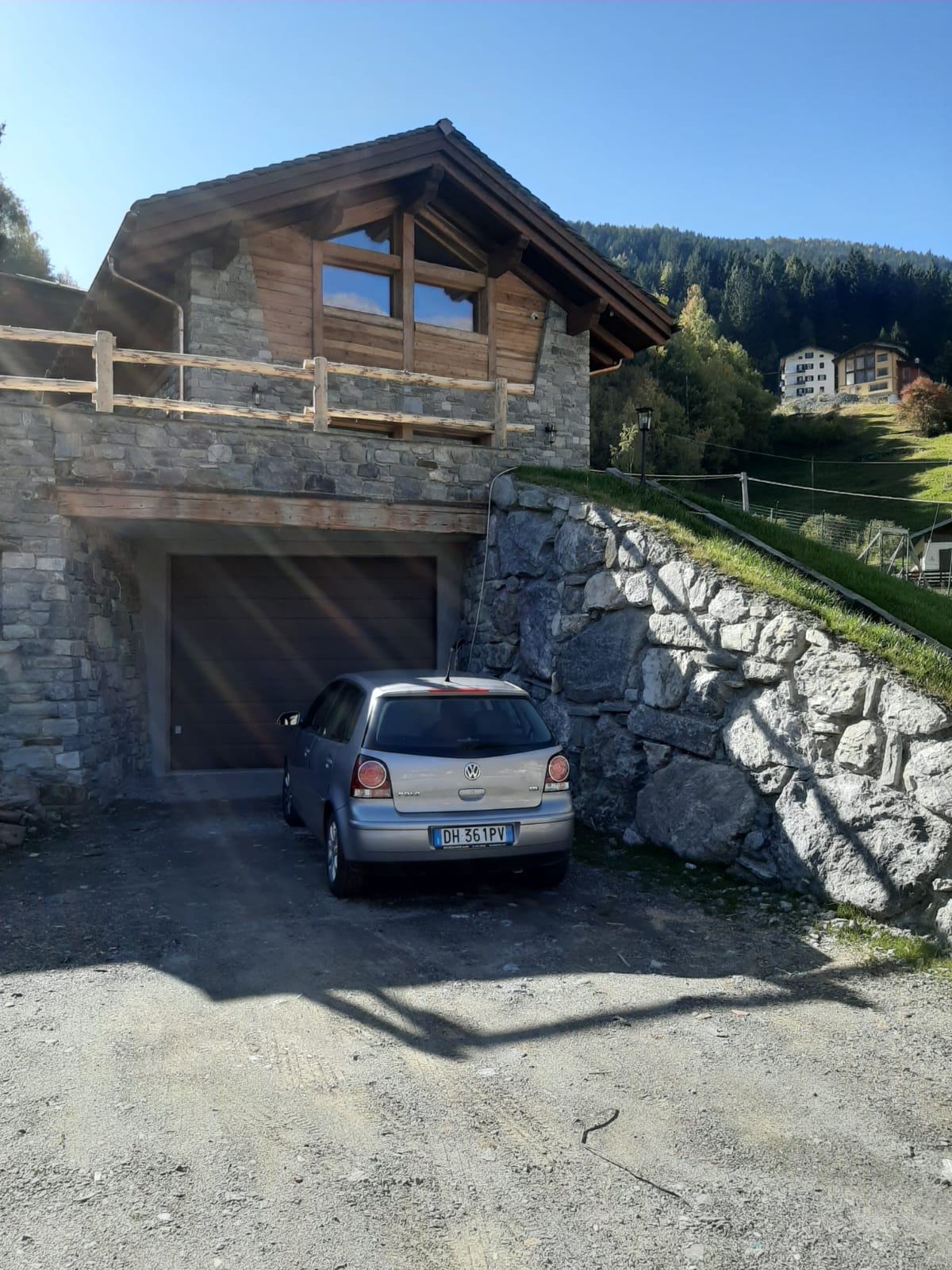 House Exterior Photo Showcasing the Garage and Stairs