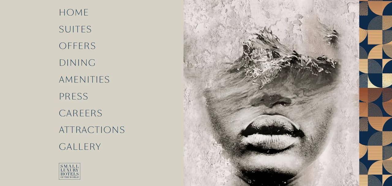 The One GT Hotel site menu shows a monochrome face artwork render beside navigation links