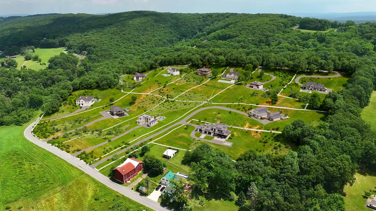 Aerial rendering of a subdivision in Danville showing proposed homes, driveways, and road layout overlaid on real drone footage