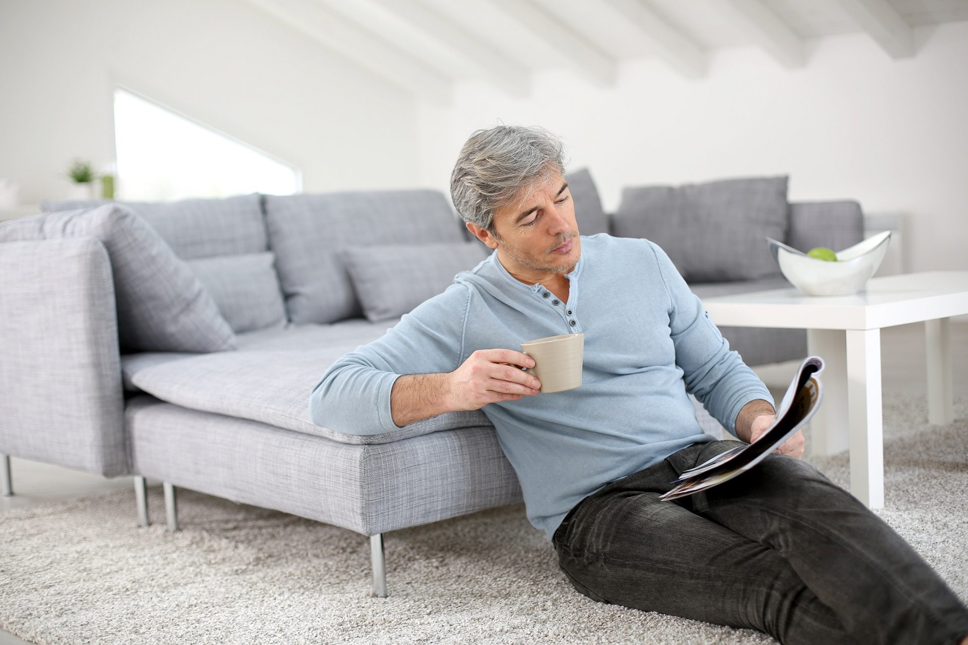 A Man Reading an Architecture Magazine