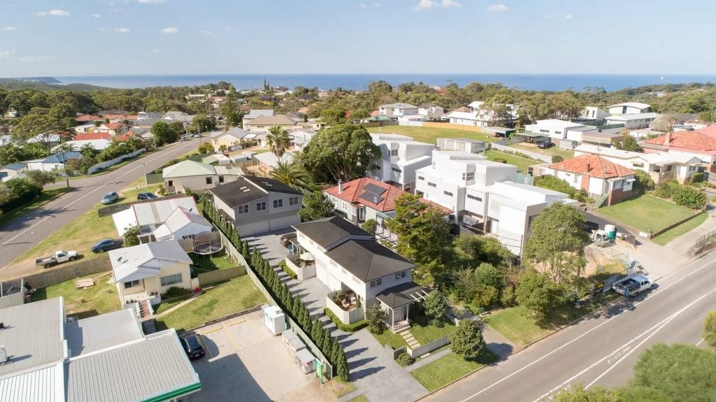 Aerial 3D rendering of a Los Angeles residential neighborhood with ocean views and multi-unit housing