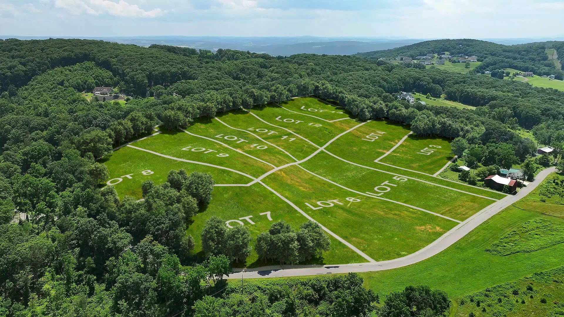 Aerial site plan rendering showing 12 numbered lots with boundary lines overlaid on drone footage of undeveloped land in Danville, PA