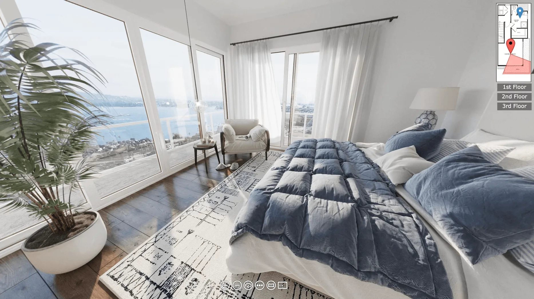 360 virtual tour of a house interior: bedroom with a blue quilt and a sea view