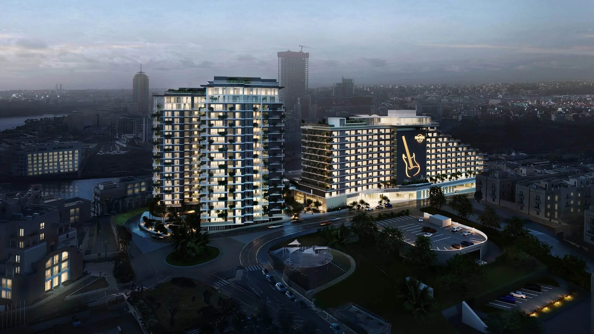 3D hotel exterior at night: aerial view of a seafront hotel complex with lit facades
