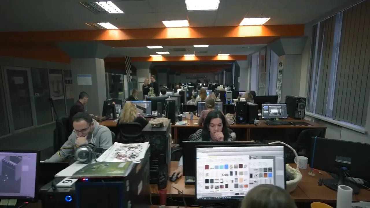 Aerial view rendering studio: ArchiCGI artists working in the open-plan office