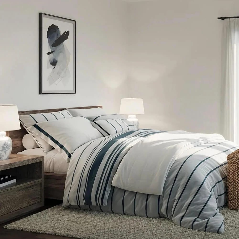 CGI interior design of a bedroom: striped bedding, framed print above the bed and a table lamp