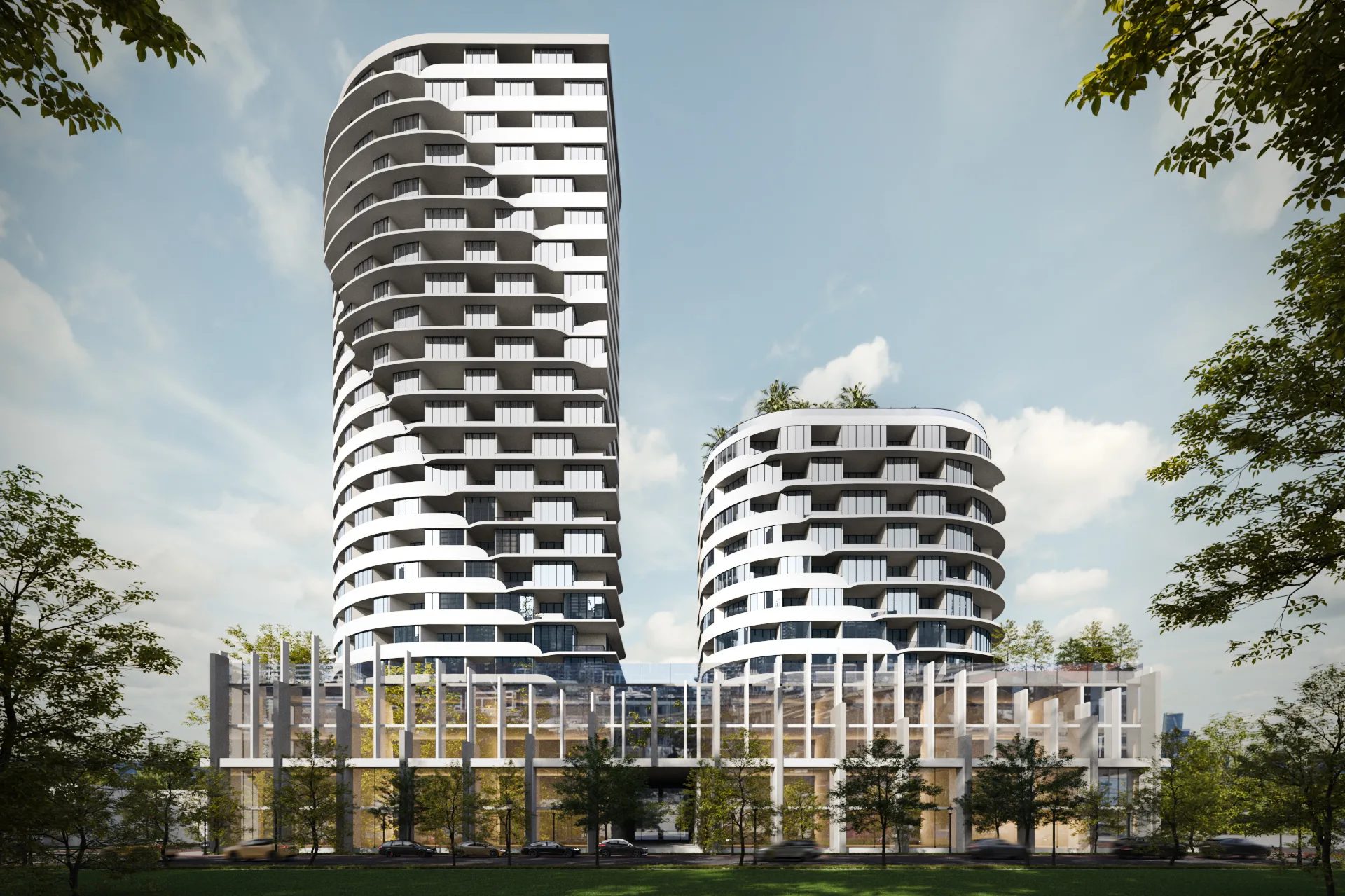 Twin curved residential towers with balconies over a landscaped podium, the condo tower format that fills the Toronto skyline