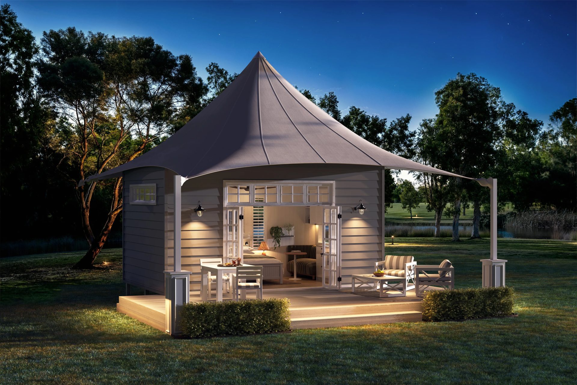 3D rendering of a lit glamping cabin at dusk with an open deck and tent roof set on a green lawn in rural Australia