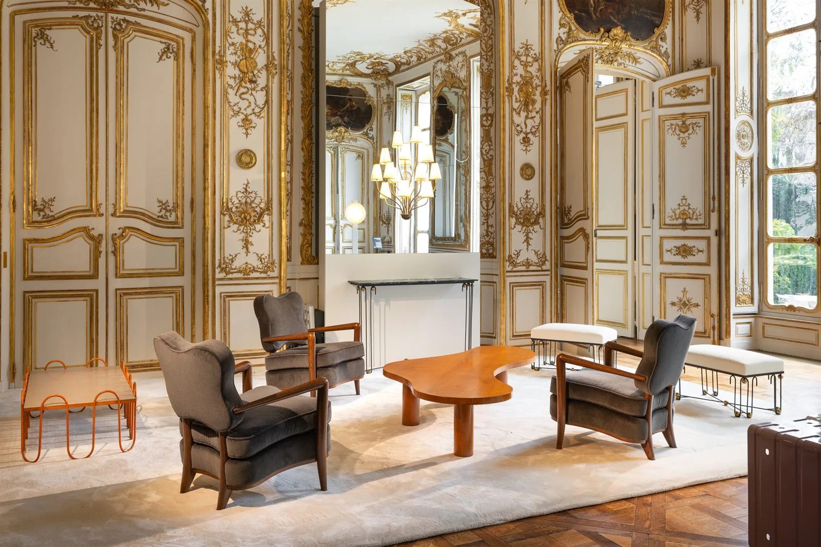 Collectible design gallery booth in a gilded salon at L’hôtel de Maisons during Design Miami Paris