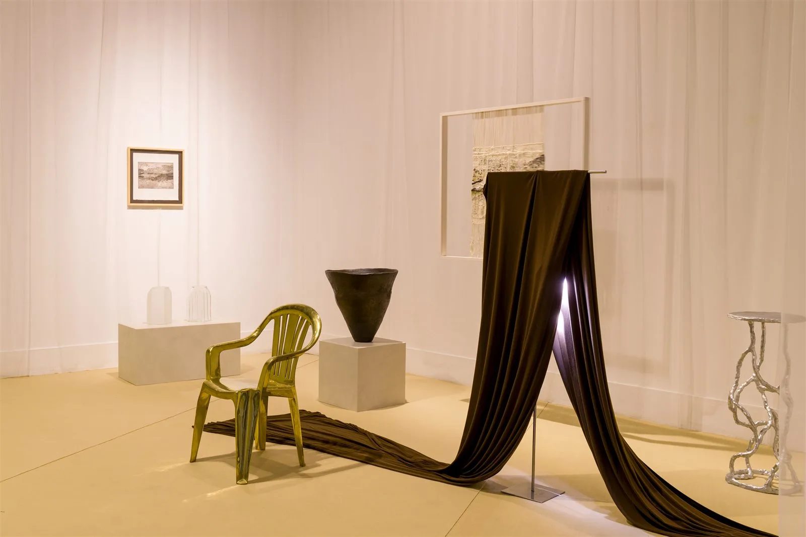 An exhibition at Madrid Design Festival with a chair, a vessel and draped fabric