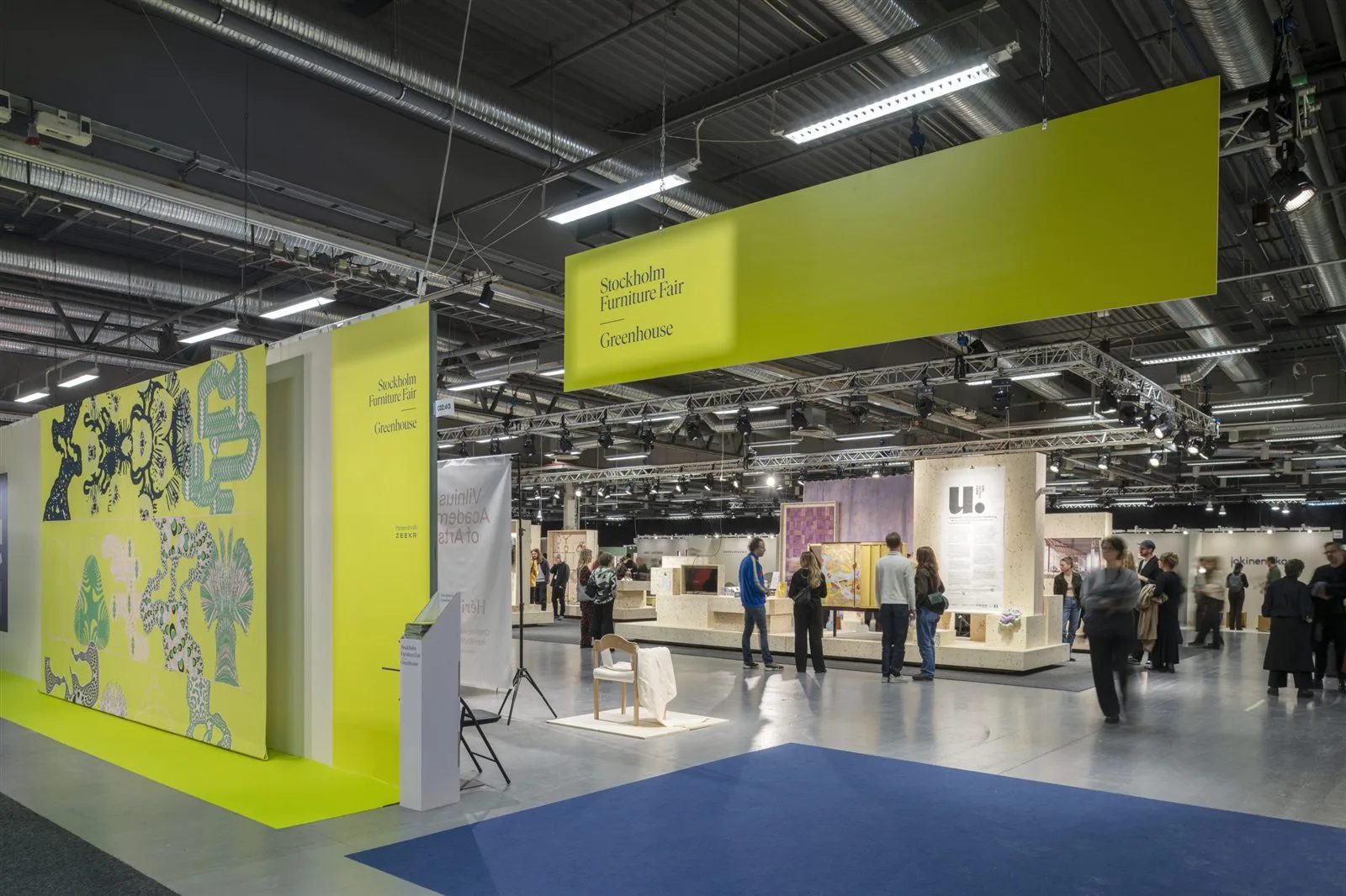 The Greenhouse hall at Stockholm Furniture Fair with visitors and exhibition stands