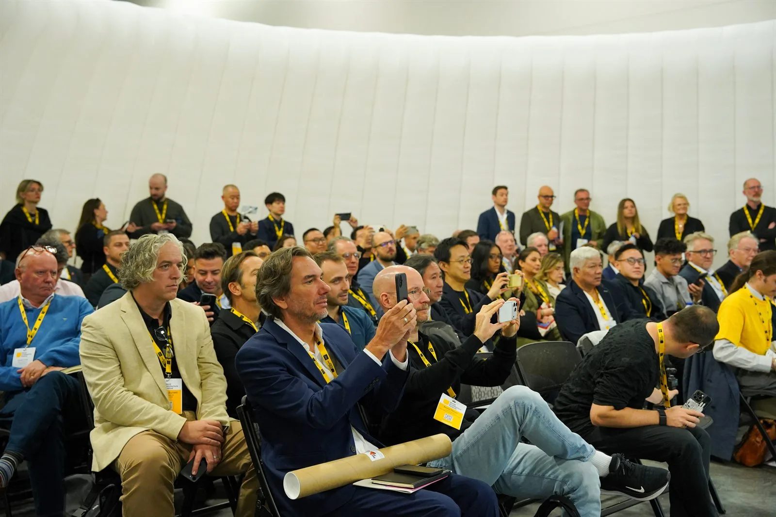 Delegates watching a live crit session in the pavilion at the World Architecture Festival