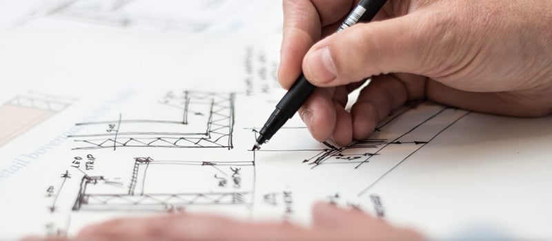 An Architect Drawing a Floor Plan of Real Estate