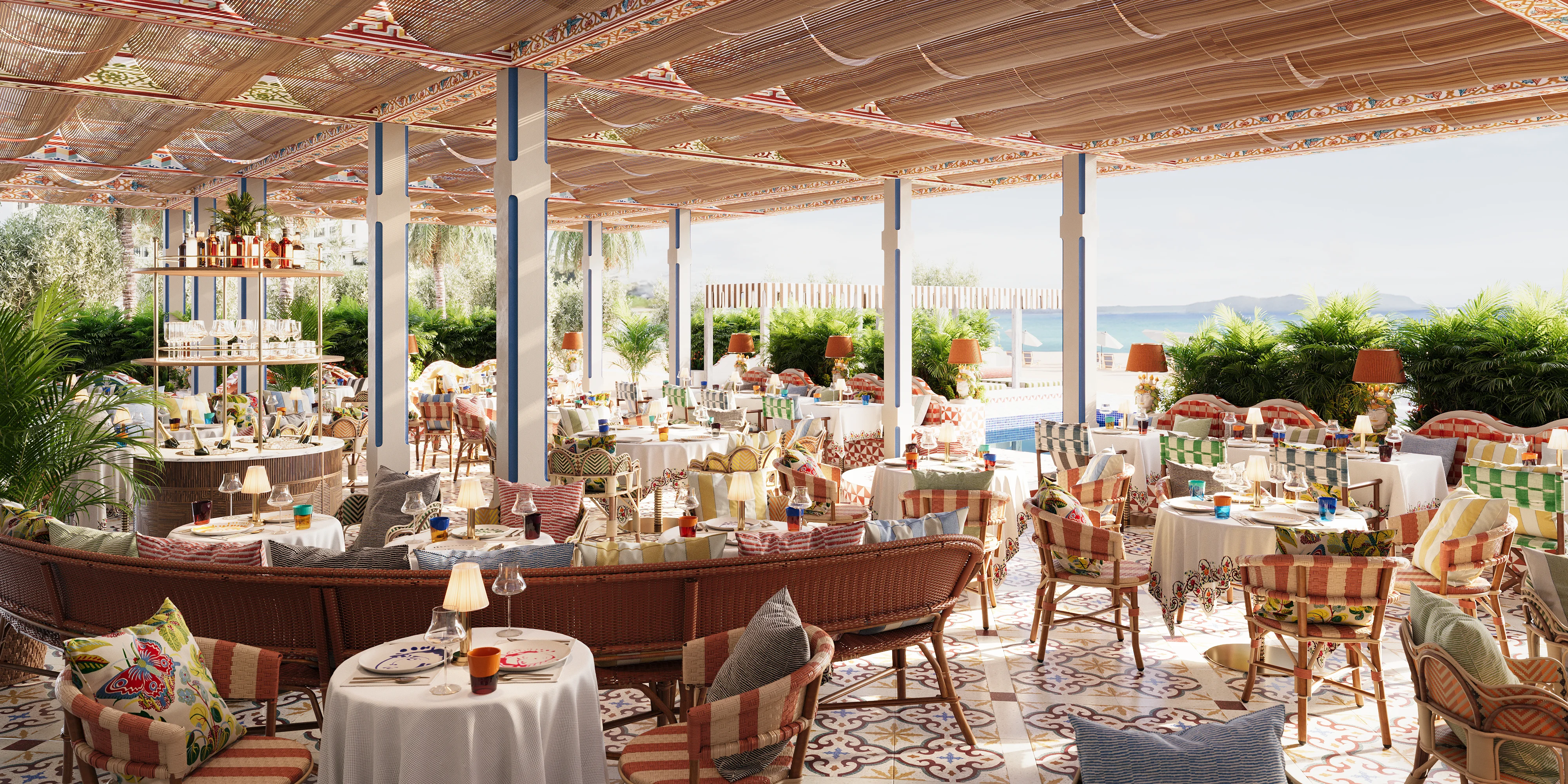 3D visualization of a resort dining terrace with patterned chairs, round tables, and ocean view backdrop