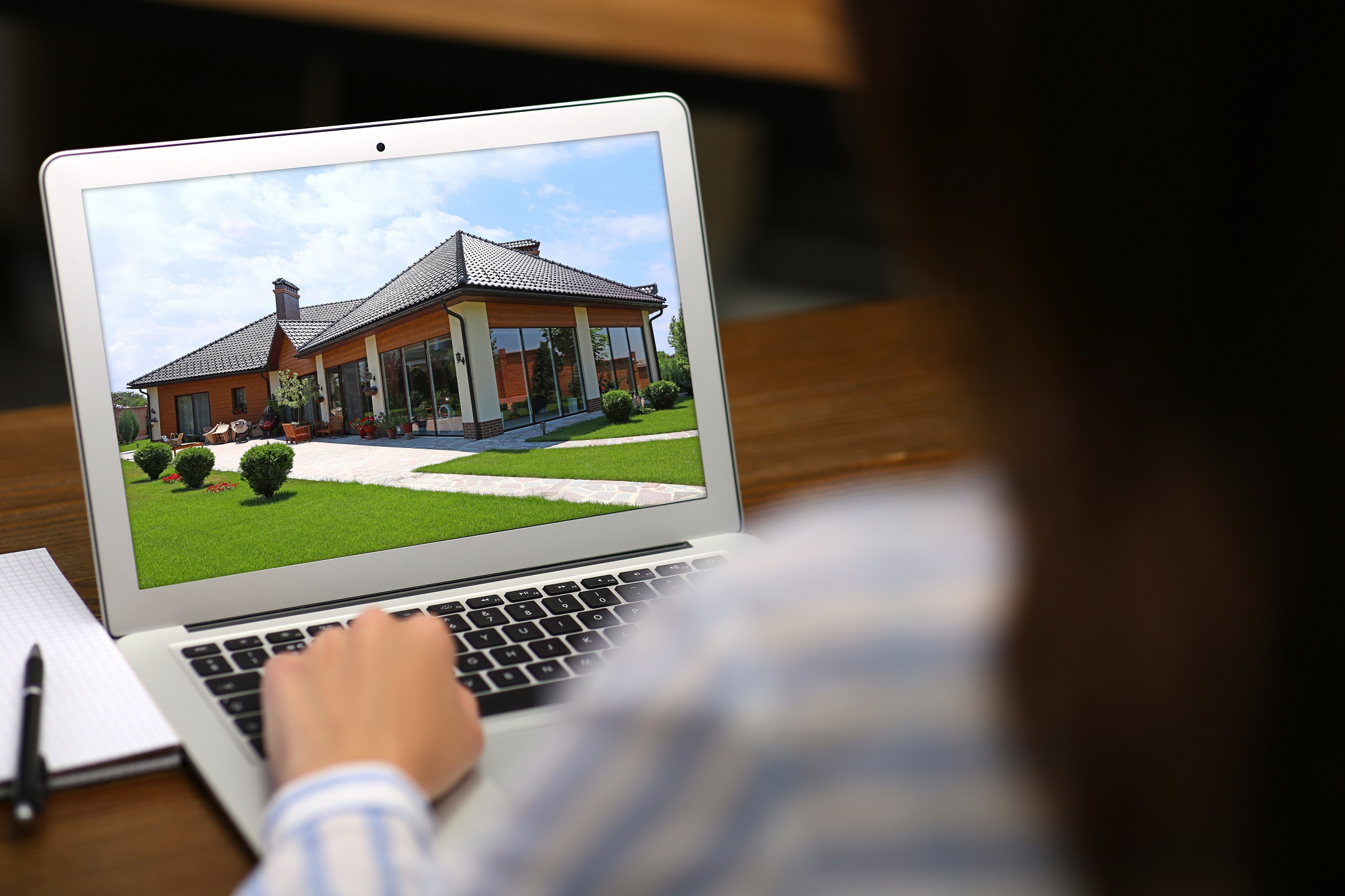 Woman Looking at a Video of an Open House