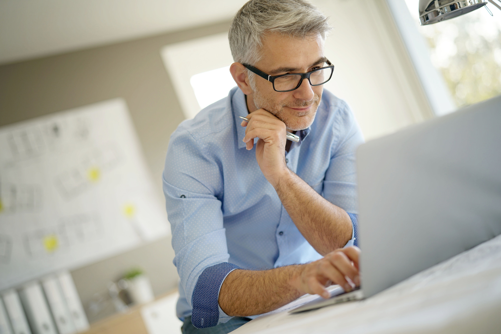 Architecture Expert Working on His Laptop