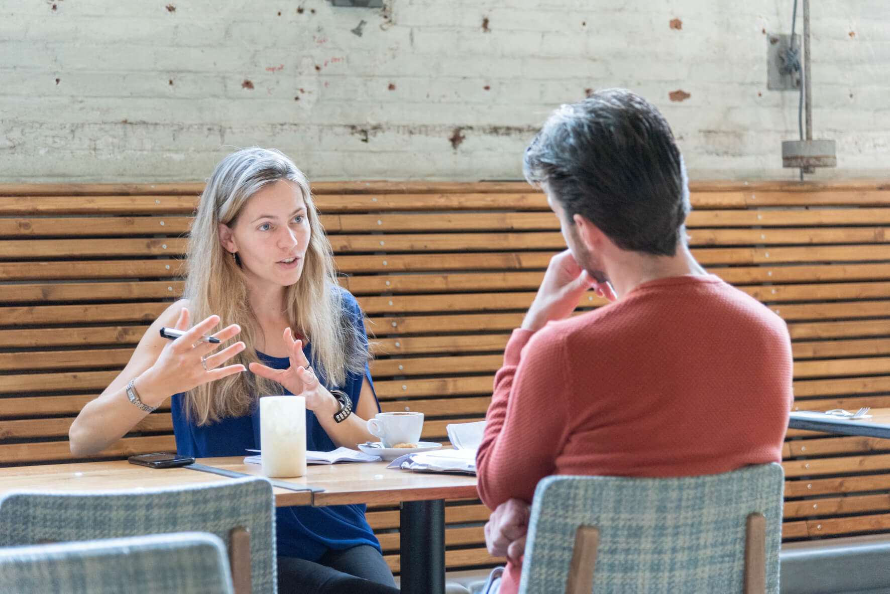 Coach Caludia Mayer Speaking to a Client