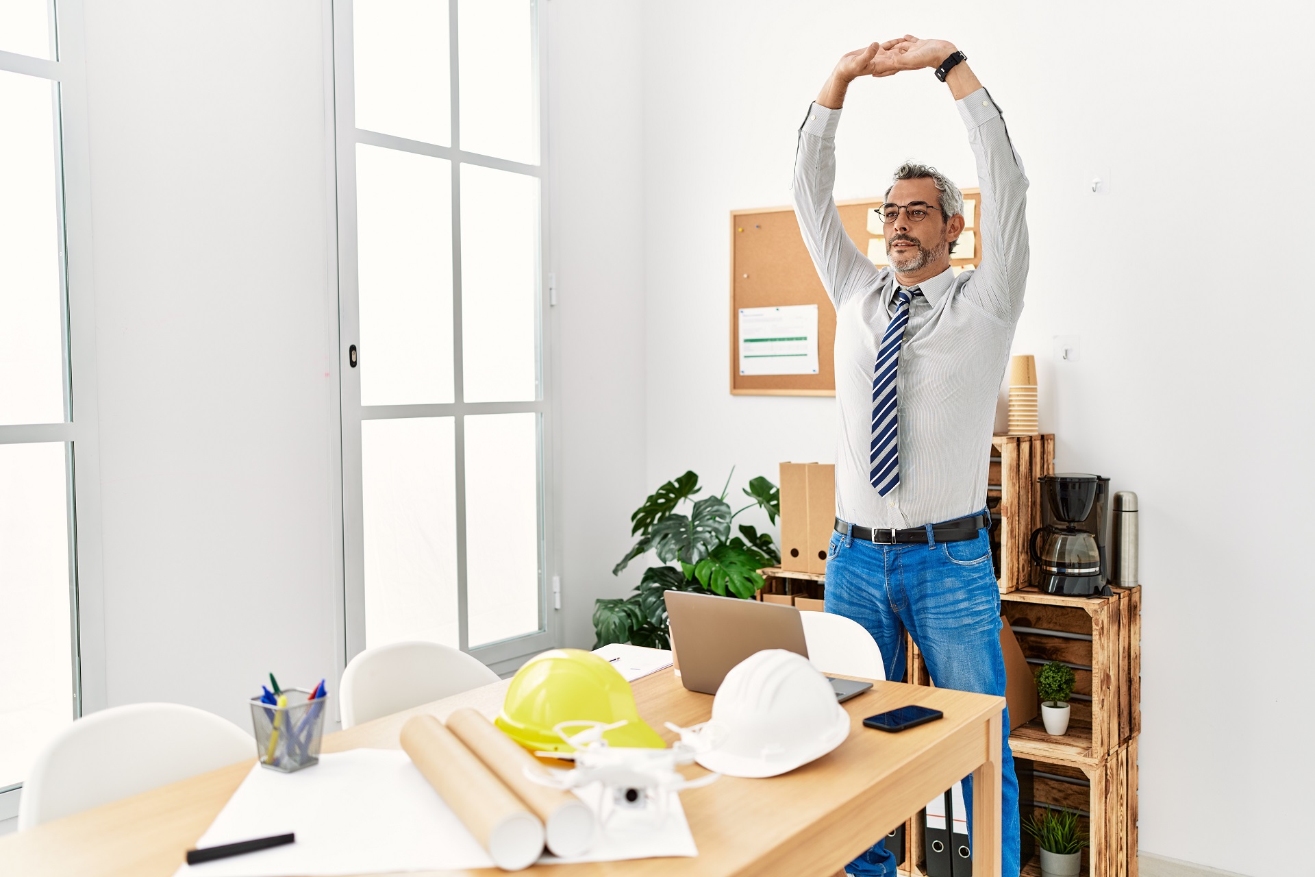 An Architect Stretching at His Office