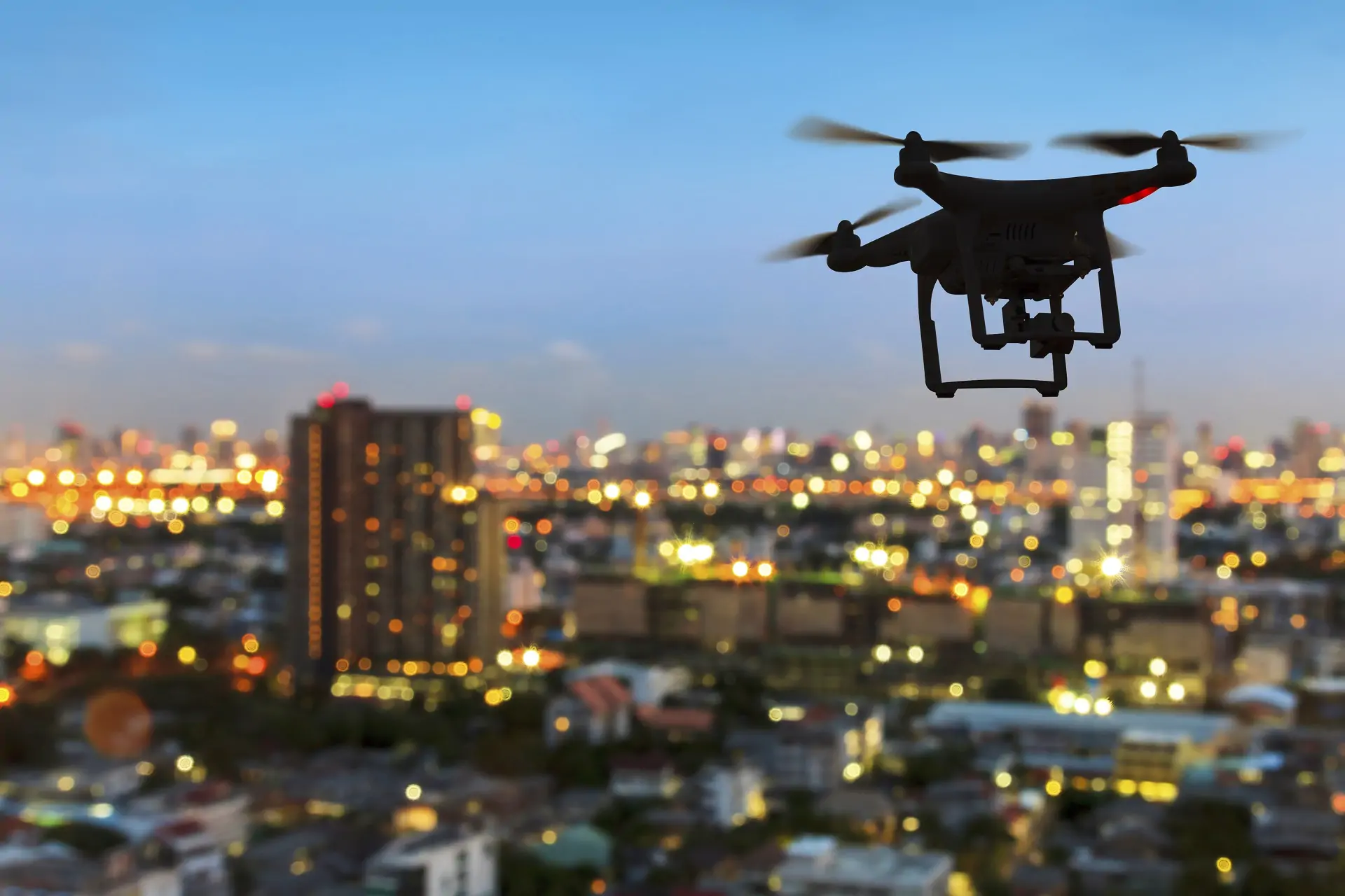 Drone Flying in Twilight above the City