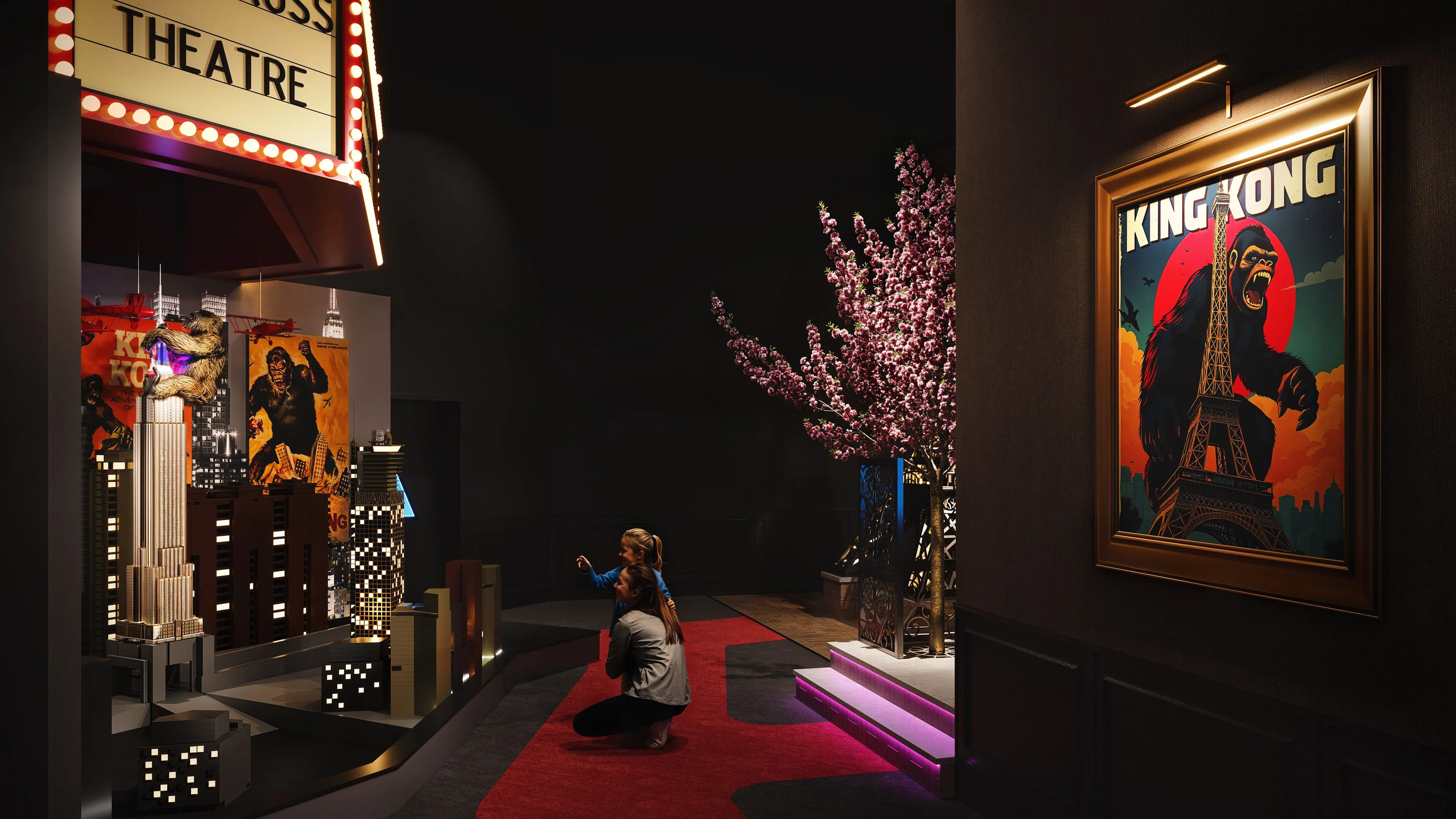 A themed installation with a King Kong miniature city and dramatic lighting in a 3D rendering of a hospitality interior