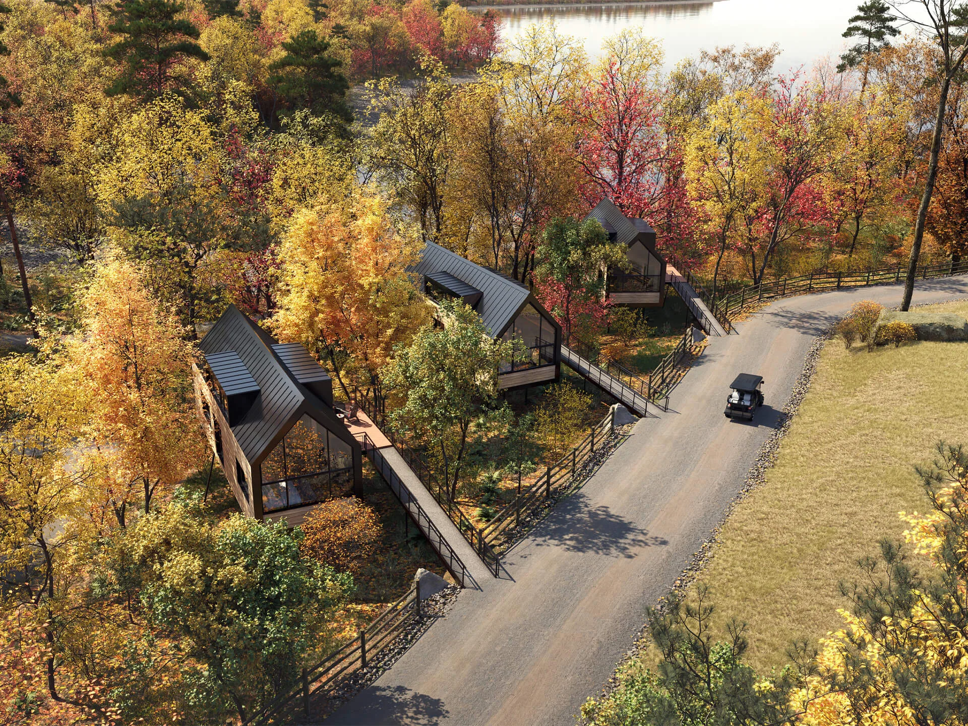 Modern cabins among autumn trees near a lake shown in an exterior 3D visualization for a Hyatt project in New York State