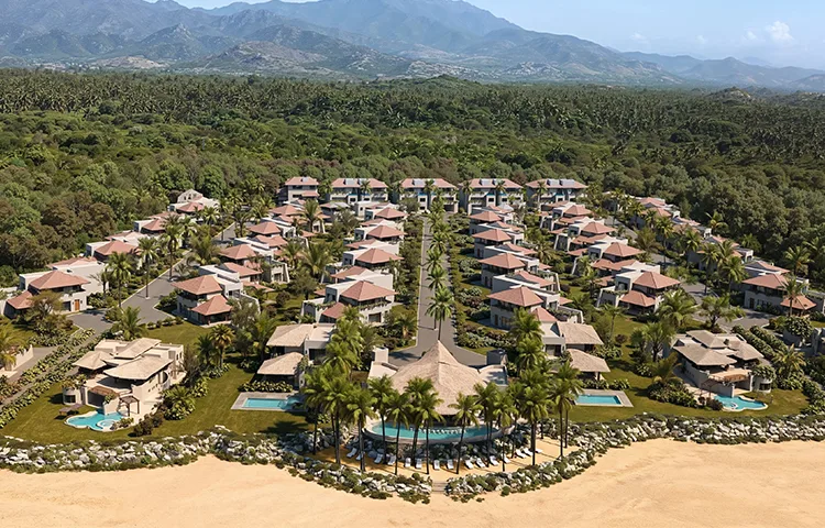 An aerial resort masterplan with villas, palms, pools, and a mountain backdrop shown in an architectural rendering